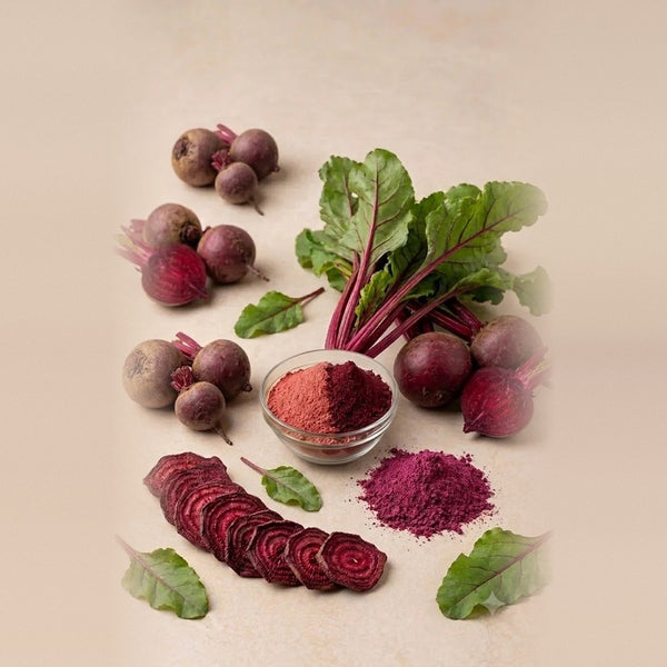 Nature Delights beetroot powder in a glass bowl with fresh beetroots, beet leaves and sliced beetroot