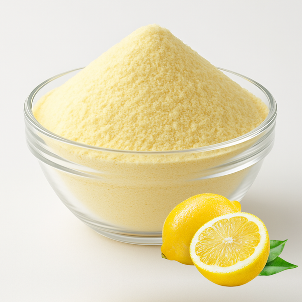 Nature Delights lemon powder in a glass bowl with a fresh lemon